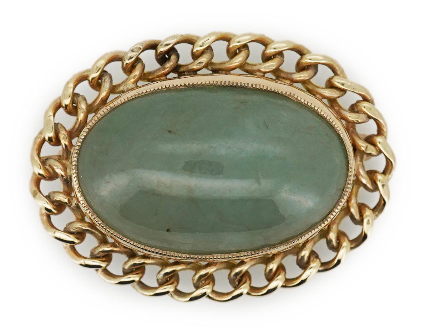 A 9ct gold and jadeite brooch